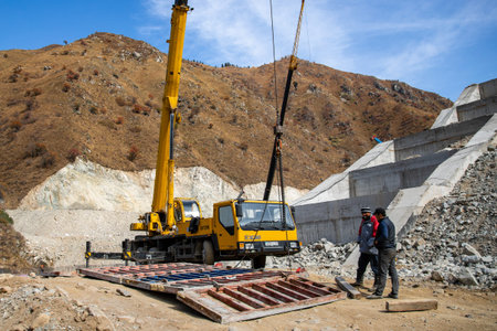 Construction of a mudflow protection dam in the Big Almaty Gorge in the mountains of Almaty. Crane...