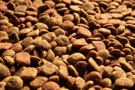 Close-up of a pile of brown colored dog food background.