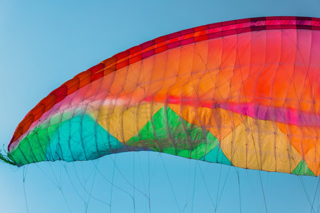 Background of colorful paraglider wing and blue sky.の写真素材