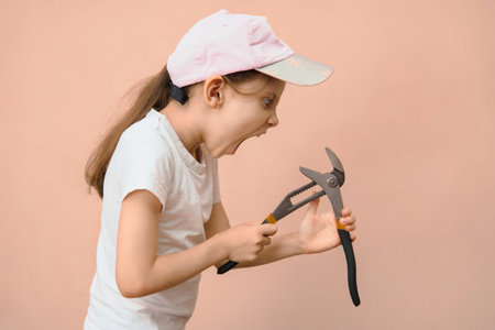 The child can not cope with the instrument and he is angry with him. Anger management in children.の写真素材