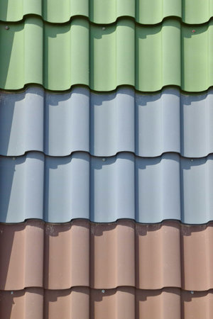 Vertical background of roofing in the form of tiles in different colors.の写真素材