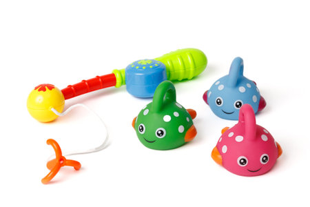 Childrens set of funny colorful fish and a fishing rod, for the development of motor skills in children.の写真素材