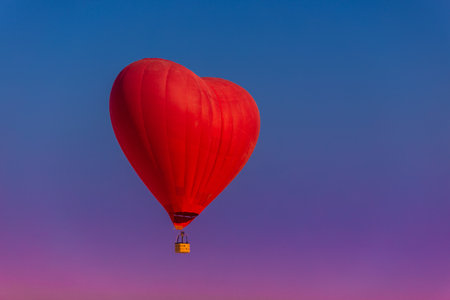 Postcard mockup with copyspace for Valentines Day with a balloon in the shape of a red heart.の写真素材