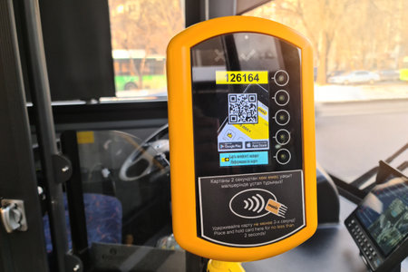 Onay validator for electronic fare wireless payment on public Almaty city transport. Almaty, Kazakhstan - January 21, 2023のeditorial素材
