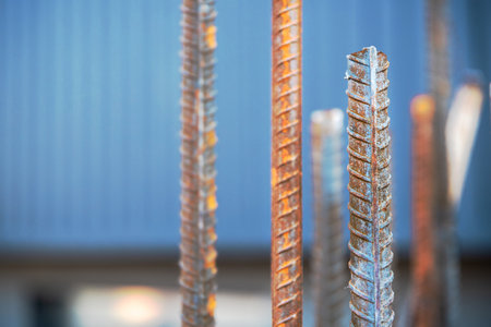 Steel bars, commonly referred to as steel reinforcement bars, are utilized on construction sites to reinforce concrete, close-up shots and selective soft focus, copy space.の写真素材
