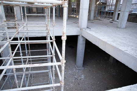An opening in the interfloor ceiling of a building under construction for the construction of an...