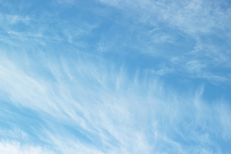 Uniform background of blue sky and cirrus cloud patterns.の写真素材