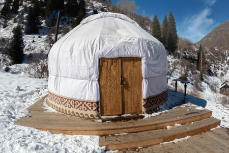 Traditional Central asian nomadic home yurt with a wooden door in the Tian Shan mountains.の写真素材
