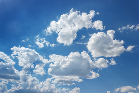 Sky was a tranquil electric blue, adorned with fluffy white cumulus clouds. This natural landscape was a serene canvas of calm and beauty in the atmosphere.の写真素材