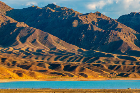 Enjoy stunning views of the Tien Shan Mountains and the Bartogay Reservoir in the Almaty region of Kazakhstan, the picturesque nature of Central Asia.の写真素材