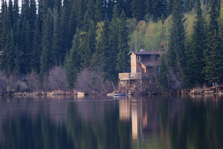 Perfect spot to spend weekend. Cabin on a lake in calm evening,の写真素材