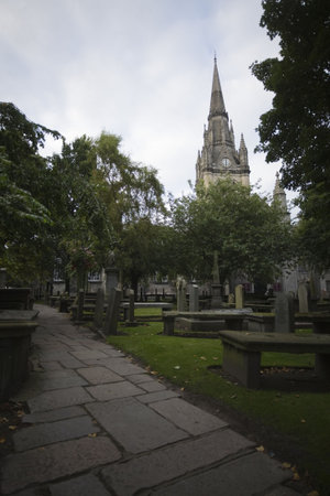 Downtown  cathedral in Aberdeen, UK, surrounded by old cemeteryの写真素材
