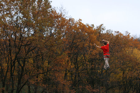 Fearless highliner walking on tight rope
