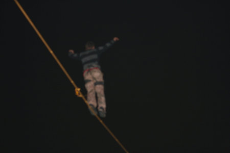 Fearless highliner walking on tight rope