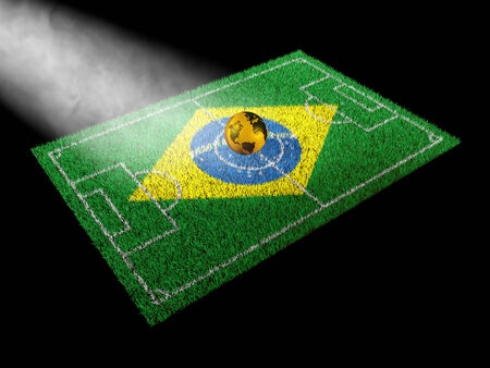 golden ball with world map on soccer fieldの写真素材