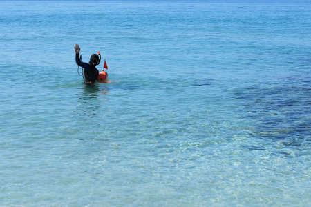 Diver is snorkeling with scuba diving equipmentの写真素材