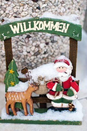 Welcome door Christmas decoration with snowの写真素材