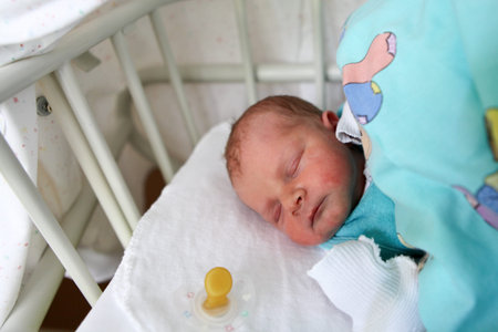 Newborn baby on his first day sleeping