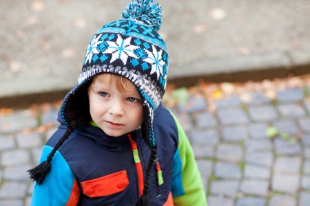 Portrait of little toddler boy in winter clothesの写真素材