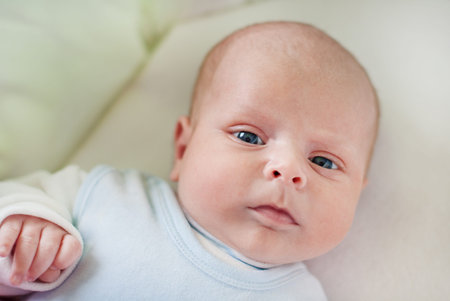 Adorable baby boy with blue eyes three months old