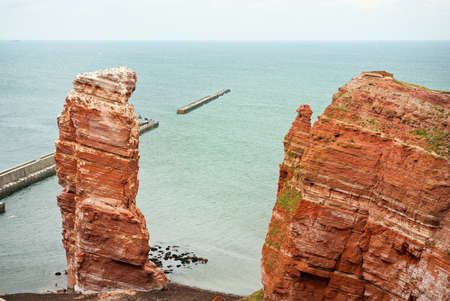 Cliff line of Heligoland with the Tall Anna, the landmark of Heligoland, Germanyのeditorial素材