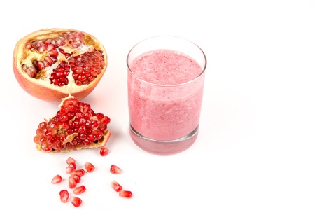 Strawberry and pomegranate healthy smoothie  Isolated on whiteの写真素材
