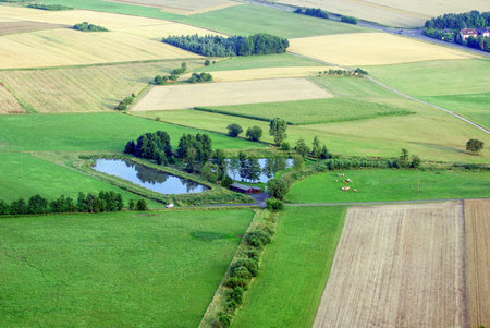 View from above on small lake during sunset from hot air baloon, Germany