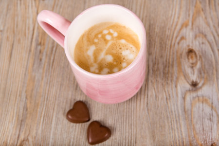 Cup of fresh coffee on wooden backgroundの写真素材