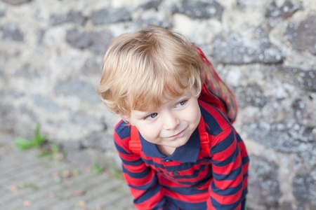 Little toddler boy on way to kindergarten outdoorの写真素材