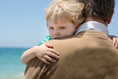 Portrait of mother and her little son on a beachの写真素材
