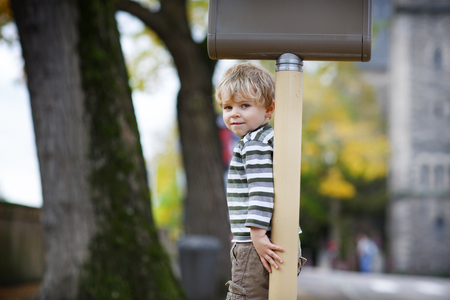Outdoors portrait of cute boy in a cityの写真素材