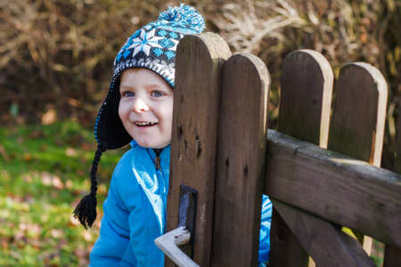 Little toddler boy having fun on playground outdoorsの写真素材