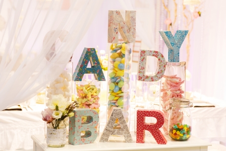 Sweet table as candy bar with different sweets on dinner or event partyの写真素材