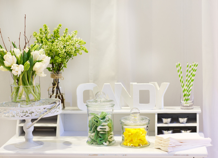 Sweet table as candy bar with different sweets on dinner or event partyの写真素材