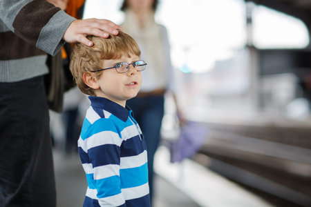 Happy little boy in a subway station