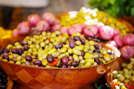 Marinated garlic and olives on provencal street market in Provence, France. Selling and buying.の写真素材