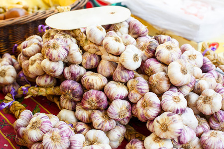 French garlic display in market in south of France, Arles, Provence. Local organic food.の写真素材