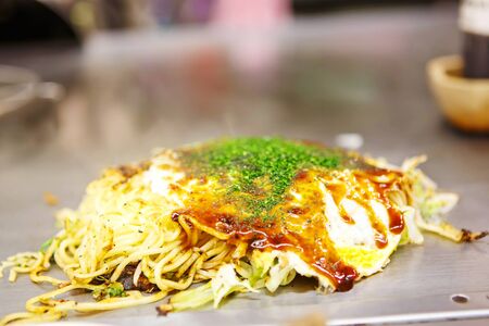 Japanese food okonomiyaki , Japanese pizza. Traditional food in Hiroshima, Japanの写真素材