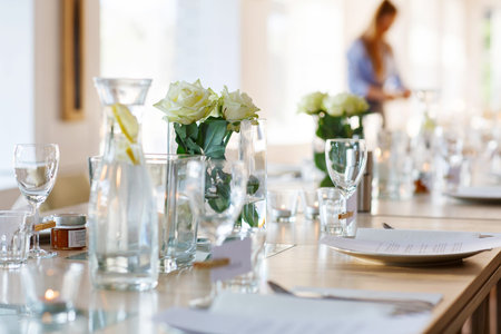 Elegant, simple and luxury table set in white for wedding or event party. In warm sunny light. With...