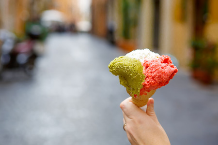 Famous italian ice cream in cone - red, white green as italian flag.の写真素材
