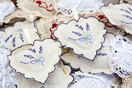 Handmade pillows with lavender decoration on farmer market in Provence, Franceの写真素材
