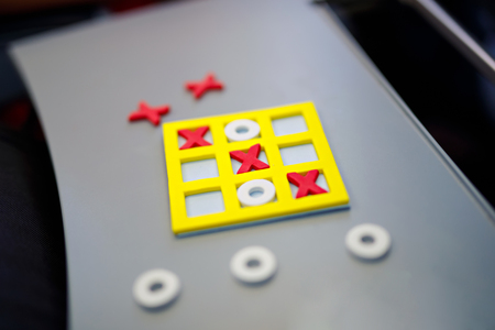 Tic tac toe game. Leisure activity for kids and adults. At home, traveling, on plane.の写真素材