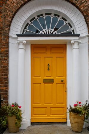 Colorful georgian doors in Dublin, Ireland. Historic doors in different colors painted as protest against English King George legal reign over the city of Dublin in Irelandの写真素材