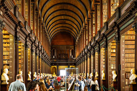 DUBLIN, IRELAND - JULY 1, 2019: The Library of Trinity College Dublin (Irish: Leabharlann CholÃ¡iste na TrÃ­onÃ³ide) serves Trinity College and the University of Dublin. Book of Kells is in this libraryのeditorial素材