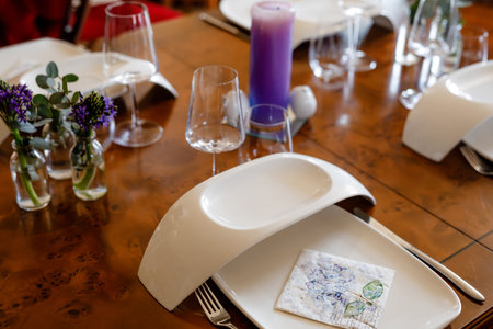 Elegant decorated table for dinner with family or friends. Fine dining at home during corona virus quarantine lockdown.の写真素材