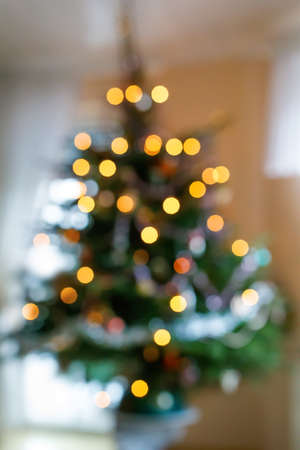 Bokeh lights illumination on decorated Christmas tree. Xmas holiday.の写真素材