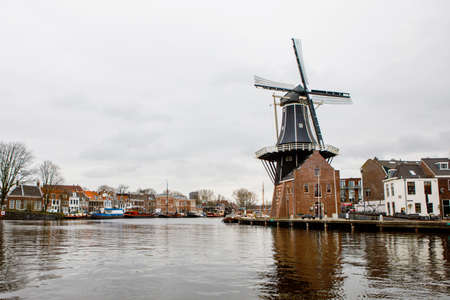Cityscape of Haarlem, the Netherlands. View of old windmill and typical Dutch houses.の写真素材