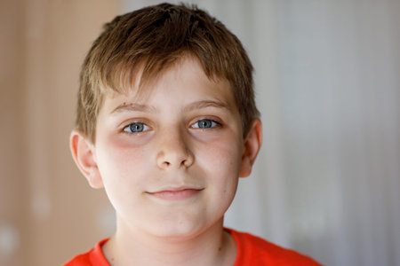 Portrait of preteen school kid boy. Beautiful happy child looking at the camera. Schoolboy smiling....