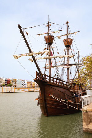 SEVILLE, SPAIN - 18 March, 2022: Nao Victoria replica ship docked at the Guadalquivir River in the historic central downtown area of Seville, Spain.のeditorial素材