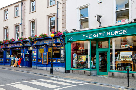 KILKENNY, IRELAND - JULY 12, 2019: Center of a small city in Leinster Province with different bars...